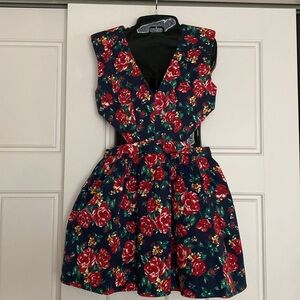 Unique dress with side cutouts and poof skirt